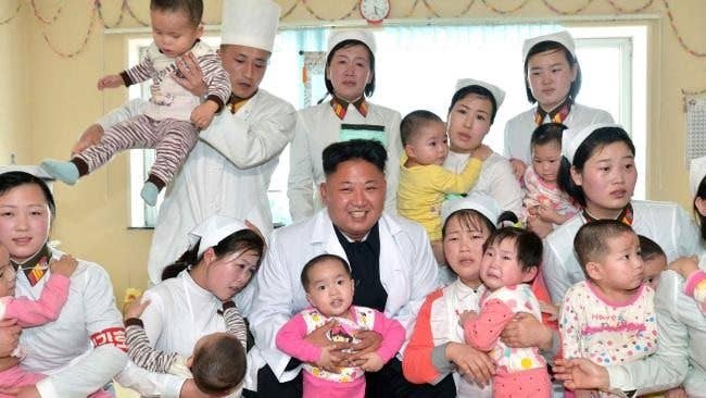 North Korean propaganda with kid photo op