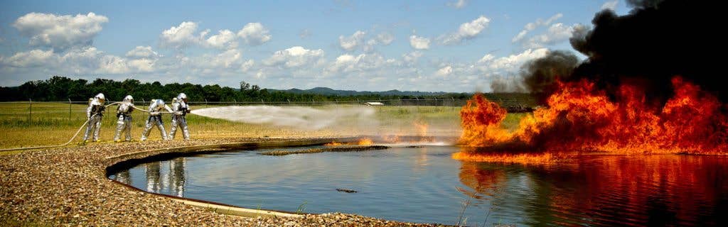 Air Force firefighters extinguish burning jet fuel during a fire training exercise at Fort McCoy, Wis. (U.S. Air Force photo by Staff Sgt. Heather Cozad)