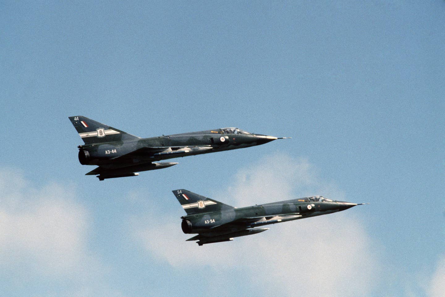 A right-side view of two Mirage III aircraft of the Royal Australian Air Force taking off on a mission during the joint Australian, New Zealand, and US (ANZUS) Exercise TRIAD '84. (USAF photo)