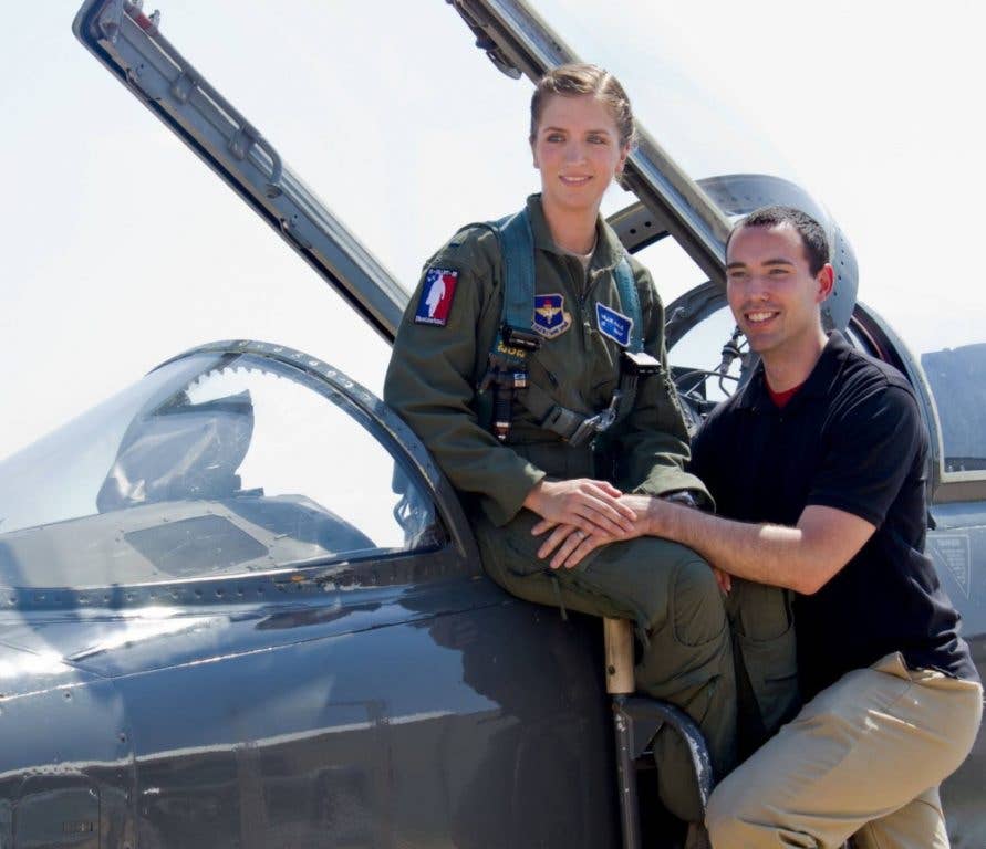 Capt. Millie Hale and Capt. Ralph Hale pose for a photo on a T-38 Talon Aug. 13, 2017, at Sheppard Air Force Base, Texas. (Photo by Airman 1st Class Alan Ricker)