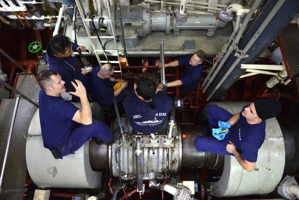 Members of the Coast Guard cutter Polar Star's engineering department make repairs in the ship's motor room while in the Ross Sea near Antarctica, Jan. 16, 2018. (U.S. Coast Guard photo by Chief Petty Officer Nick Ameen)