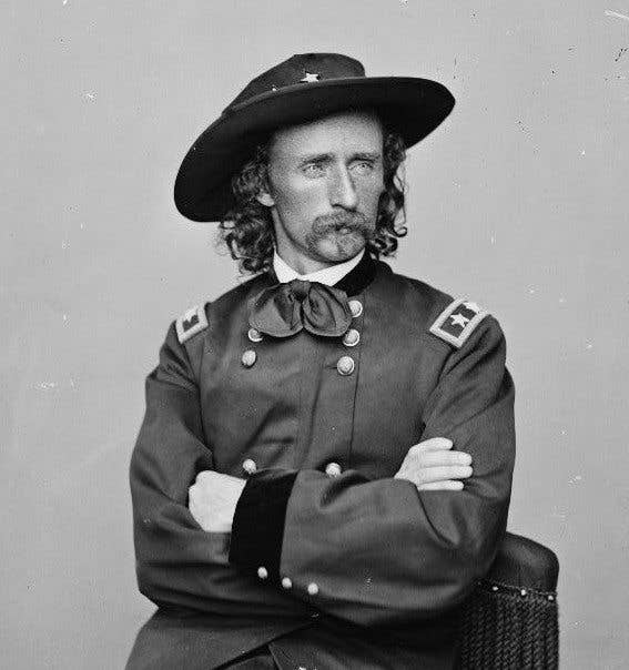 Custer was known for his golden locks, mercurial disposition, and his killer 'stache right up to the point when he took an arrow or two at Little Big Horn.
