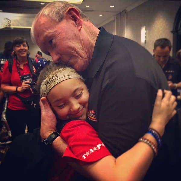 Lizzy hugging now-retired Gen. Dempsey at this year's TAPS Good Grief Camp in DC. (Photo: TAPS.org)