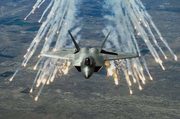 An F-22 deploys flares. (Photo by: US Air Force)