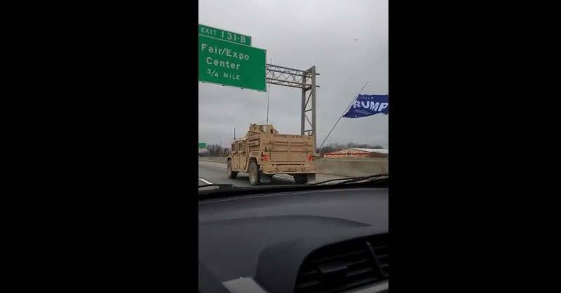 A Trump flag flying from the lead vehicle as SEALs convoy between two training locations. (YouTube screenshot)