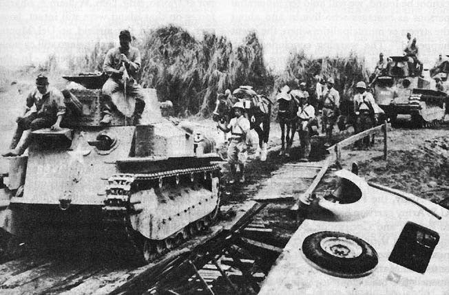 Japanese light tanks moving toward Manila on the day the city fell. (U.S. Army photo)