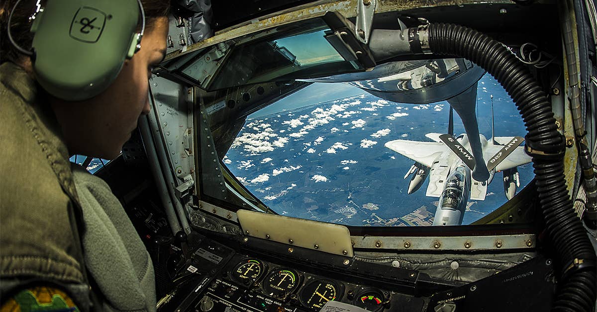 Senior Airman Crystal Cash refuels a 125th Fighter Wing F-15 Eagle on the way to exercise Vigilant Shield 15, Oct. 20, 2014, near MacDill Air Force Base, Fla. (U.S. Air Force photo by Tech. Sgt. Brandon Shapiro)