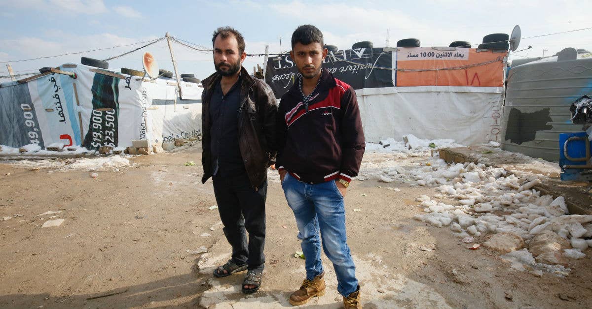 Syrian brothers who are now refugees living in an informal tented settlement in Lebanon's Bekaa Valley. Photo from DFID Flickr.
