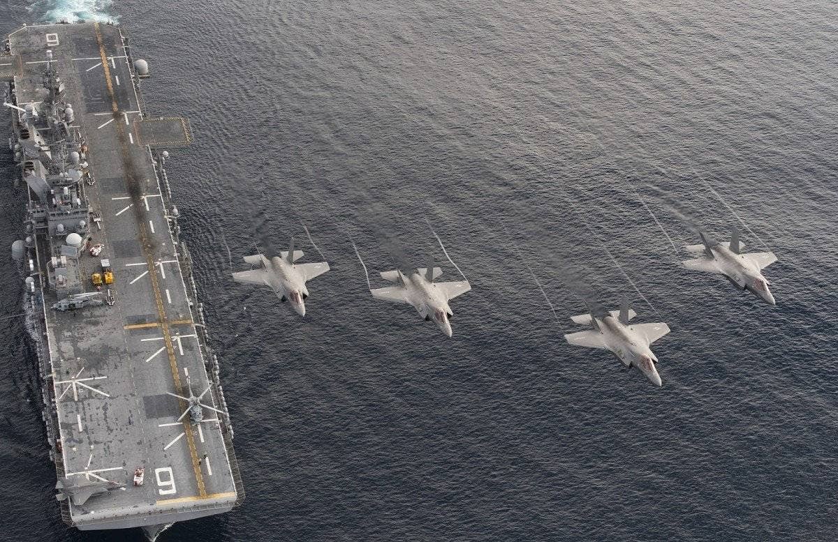 Four F-35B Lightning II aircraft perform a flyover above the amphibious assault ship USS America (LHA 6) during the Lightning Carrier Proof of Concept Demonstration. | US Navy photo by Andy Wolfe