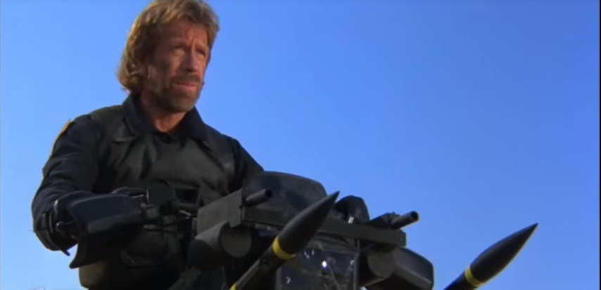 Chuck Norris and his motorcycle. He'd probably have preferred the vehicles from Polaris Defense. (Youtube Screenshot)