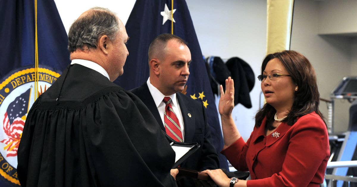 Tammy Duckworth (right) is sworn in as assistant secretary of veterans affairs for public and intergovernmental affairs by Judge John J. Farley on May 20, 2009. Photo from Department of Veterans Affairs.