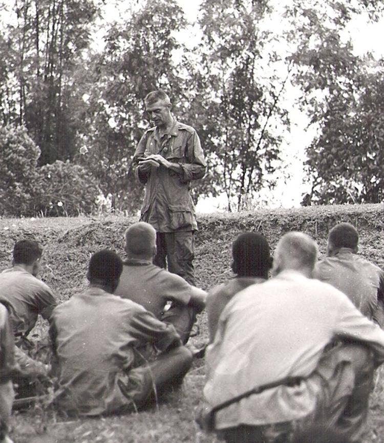 Chaplain Capodanno celebrating a Catholic Mass for Marines during a lull in fighting in Vietnam (Photo US Marine Corps)