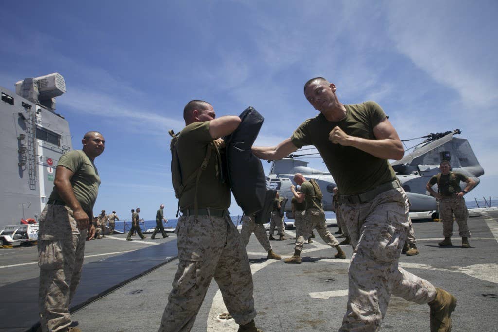 Marine demonstrating throat punch move