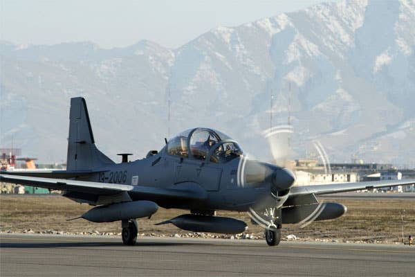 An A-29 Super Tucano taxis across the airfield at Hamid Karzai International Airport in Afghanistan. The light air-support aircraft will be added to the Afghan air force in the spring of 2016. | U.S. Air Force photo by Nathan Lipscomb