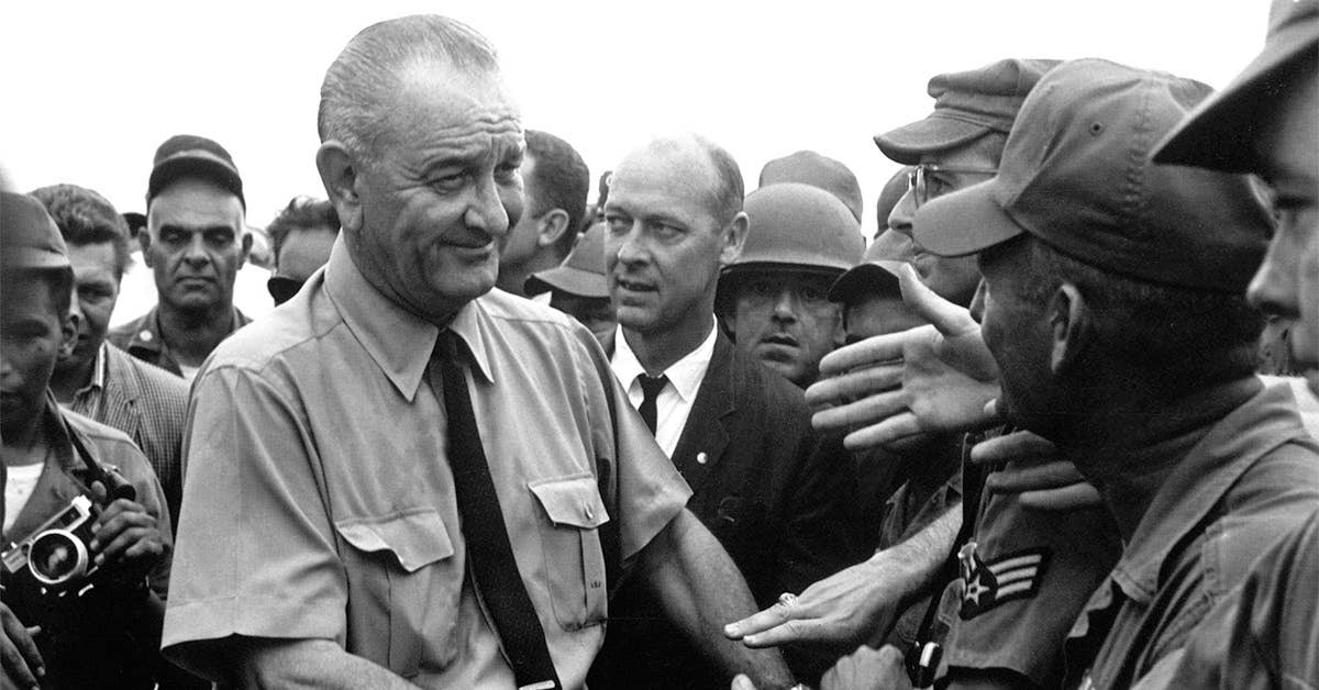 President Lyndon B. Johnson greets American troops in Vietnam, 1966. Image fro US State Department.