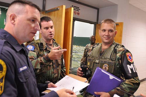 Members of the Virginia Defense Force, Shelter Augmentation Liaison Team provide assistance to the Virginia State Police during the 2011 State Managed Shelter Exercise (Photo by Staff Sgt. Andrew H. Owen, Virginia Guard Public Affairs)