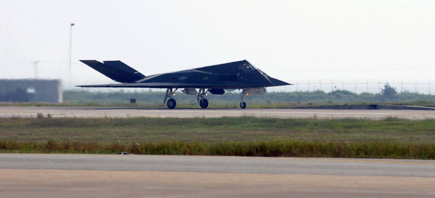 An F-117 Stealth Fighter takes off for a mission from the flightline. (U.S. Air Force photo by Staff Sgt. Michael R. Holzworth)