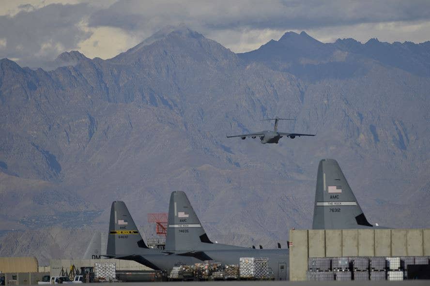 A C-17 Globemaster III takes off into the mountains Oct. 23, 2014, at Bagram Air Field, Afghanistan. Since 2006, the annual airfield traffic count has increased from 143,705 to 333,610 as the support for Operation Enduring Freedom nears its end. (U.S. Air Force photo/Staff Sgt. Evelyn Chavez)