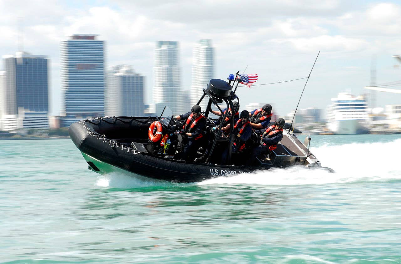 A boatcrew from Coast Guard Maritime Safety and Security Team 91114 conducts high-speed maneuvers during a security patrol south of the Port of Miami. (USCG photo)