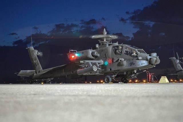resting apache helicopter photos