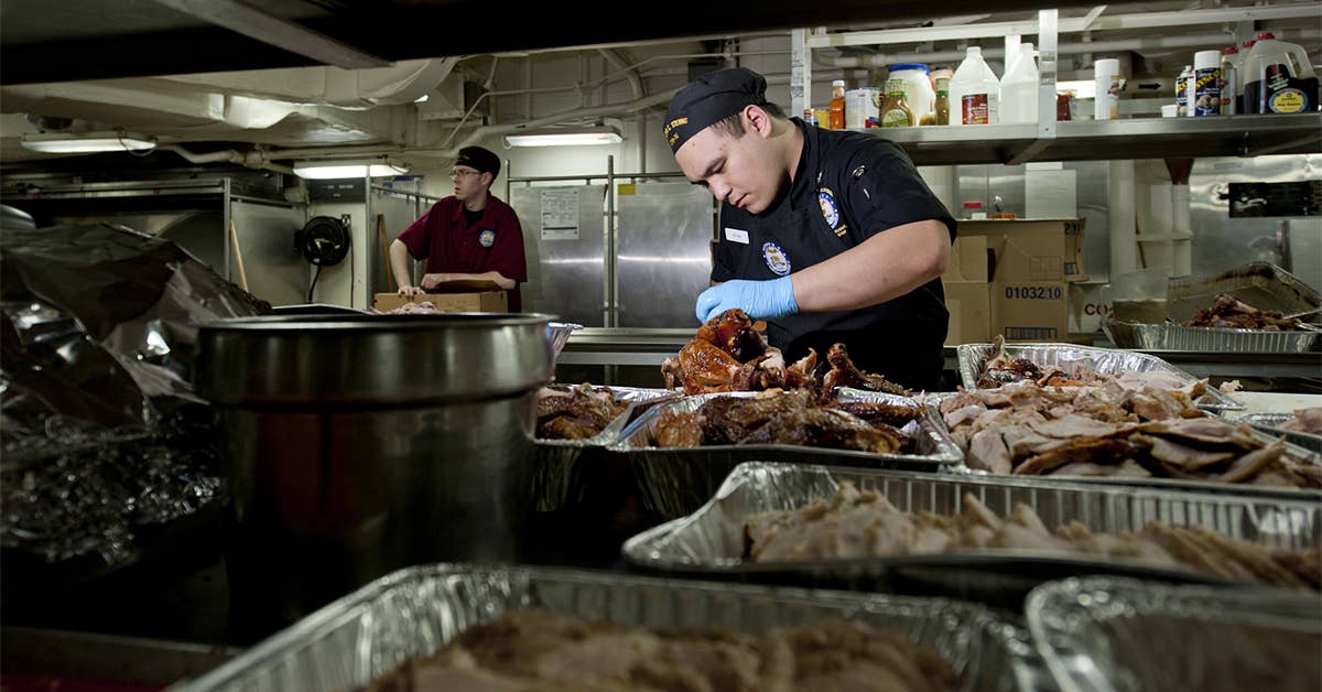 Culinary Specialist 3rd Class David Yuzon carves slices of turkey in preparation for the Christmas meal in the aft galley aboard the Nimitz-class aircraft carrier USS John C. Stennis (CVN 74). John C. Stennis is deployed to the U.S. 5th Fleet area of responsibility supporting Operation Enduring Freedom. (U.S. Navy photo by Mass Communication Specialist 3rd Class Kenneth Abbate)