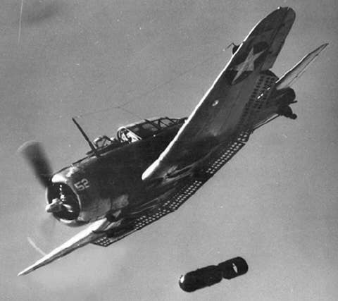 A SBD Dauntless doing what it does best: Dropping bombs. (US Navy photo)