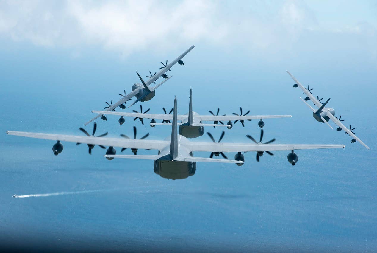Four U.S. Air Force MC-130J Commando IIs from the 17th Special Operations Squadron break out of a formation June 22, 2017 off the coast of Okinawa, Japan, during a mass launch training mission. Airmen from the 17th SOS conduct training operations often to ensure they are always ready to perform a variety of high-priority, low-visibility missions throughout the Indo-Asia-Pacific-Region. (U.S. Air Force photo by Senior Airman John Linzmeier)
