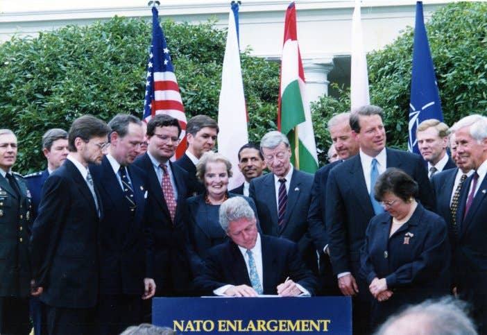 President Clinton signs the NATO Enlargement Pact on May 21, 1998 admitting Poland, Hungary and the Czech Republic.