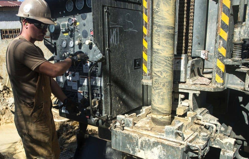 Equipment Operator 2nd Class Patrick Reiter, assigned to Naval Mobile Construction Battalion 1, operates a rig during water well drilling operations in support of Southern Partnership Station 17, a U.S. Navy deployment executed by U.S. Naval Forces Southern Command/U.S. 4th Fleet, focused on subject matter expert exchanges with partner nation militaries and security forces in Central and South America. (U.S. Navy Combat Camera photo by Mass Communication Specialist 2nd Class Brittney Cannady)