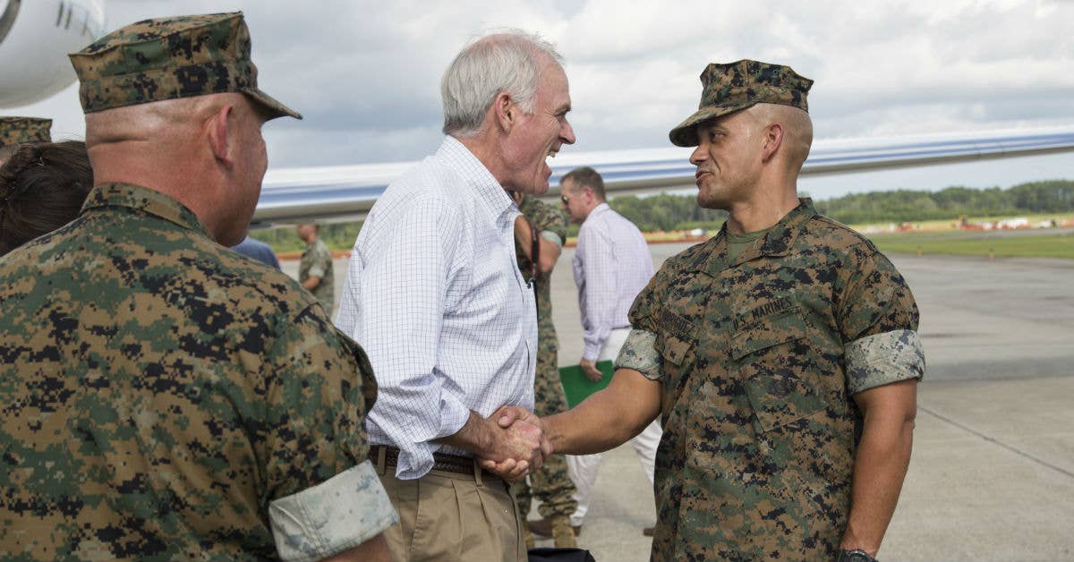 US Marine Corps Sgt. Maj. Rafael Rodriguez (right), command sergeant major of Marine Corps Recruit Depot Parris Island and Eastern Recruiting Regions, greets Secretary of the Navy Richard V. Spencer. Photo by Lance Cpl. Erin Ramsay.
