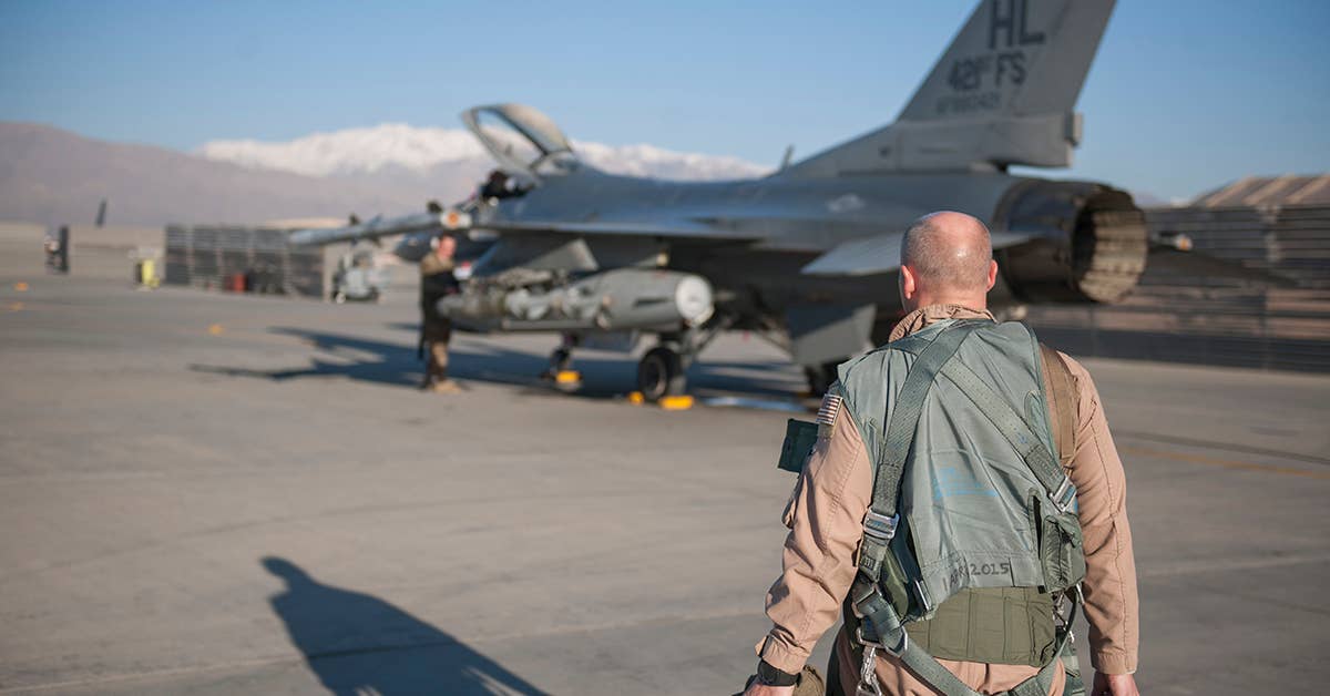 Col. Henry Rogers, 455th Expeditionary Operations Group commander, walks to his F-16 for a sortie with the 421st Expeditionary Fighter Squadron at Bagram Air Field, Afghanistan, Nov. 27, 2015. USAF photo by Tech. Sgt. Robert Cloys.