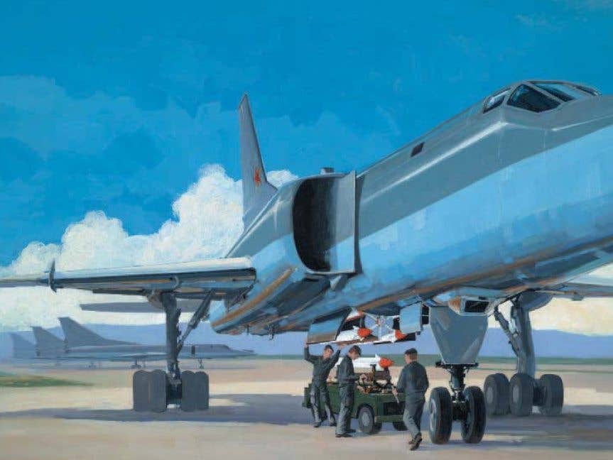 This painting shows ground crews loading AS-16 Kickback air-to-surface missiles on a Tu-22M Backfire. (DOD painting)