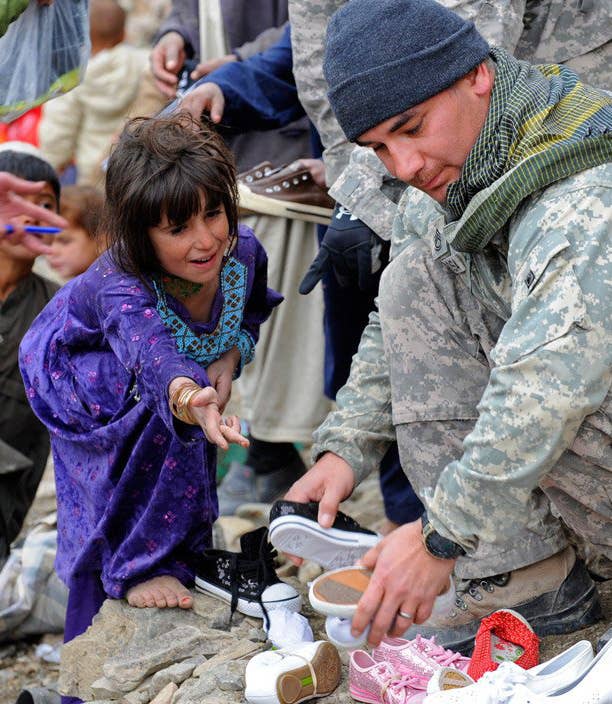 US Troops help distribute winter supplies in Safidar Village, Afghanistan.