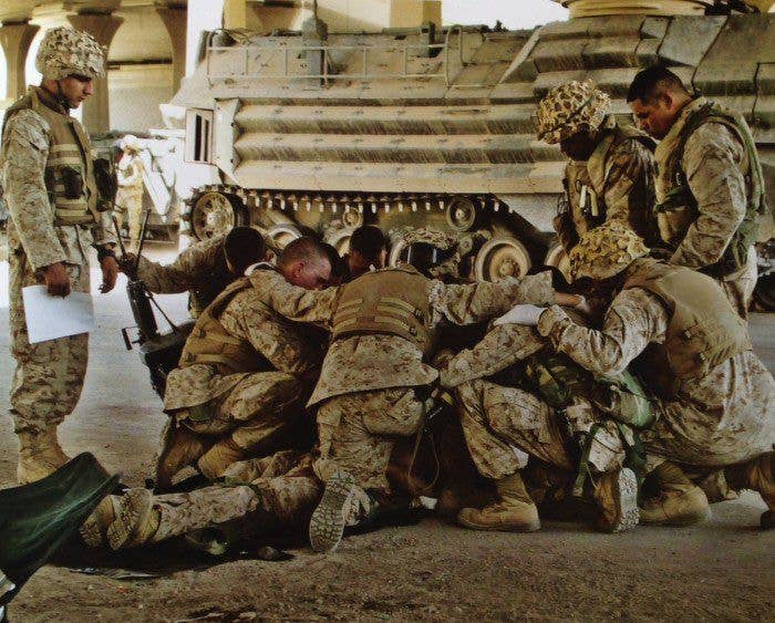 2005 - Marines huddle over wounded comrade during fighting in Anbar Province pulitzer prize