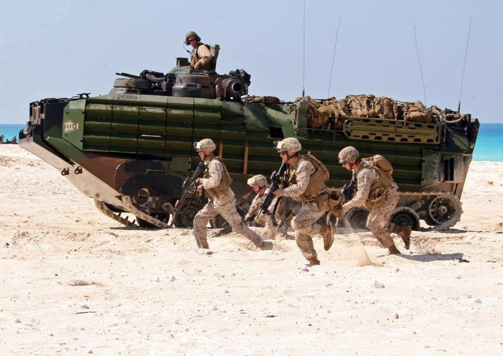 U.S. Marines with India Company, Battalion Landing Team, 3rd Battalion, 2nd Marine Regiment, 22nd Marine Expeditionary Unit run on the beach during an amphibious assault demonstration conducted as part of Exercise Bright Star 2009 in Alexandria, Egypt, on Oct. 12, 2009.  DoD photo by Cpl. Theodore W. Ritchie, U.S. Marine Corps. (Released)