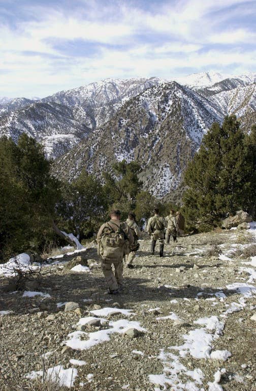 U.S. Navy SEALs search for al-Qaida and Taliban while conducting a Sensitive Site Exploitation mission in the Jaji Mountains, Jan. 12, 2002. Navy Special Operations Forces are conducting missions in Afghanistan in support Operation Enduring Freedom. (U.S. Navy photo by Petty Officer 1st Class Tim Turner)