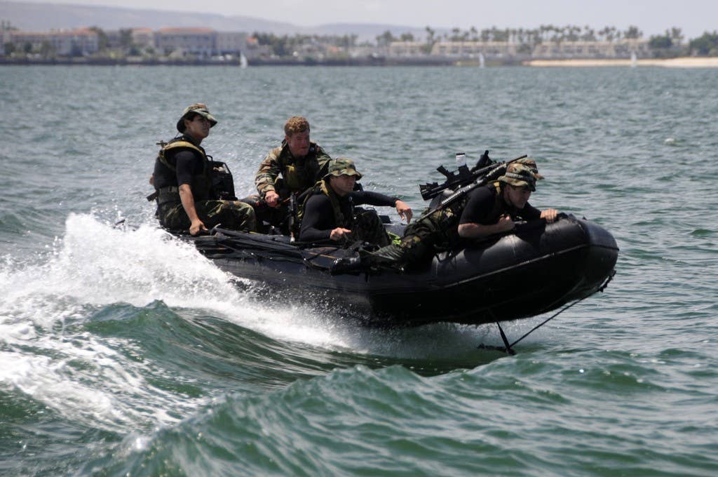 U.S. Navy SEAL Qualification Training students ride an inflatable boat in San Diego Bay after plotting a course on a map during their 12 days of maritime operations training on June 16, 2009. DoD photo by Petty Officer 2nd Class Kyle D. Gahlau, U.S. Navy. (Released)