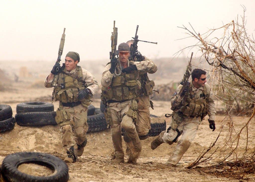 Remote Training Facility (February 22, 2004) -- Members of a SEAL Team practice desert training exercises in preparation for real world scenarios.Official U.S. Navy photo by Photographer's Mate 2nd Class Eric S. Logsdon, Naval Special Warfare Command Public Affairs Office. (RELEASED)
