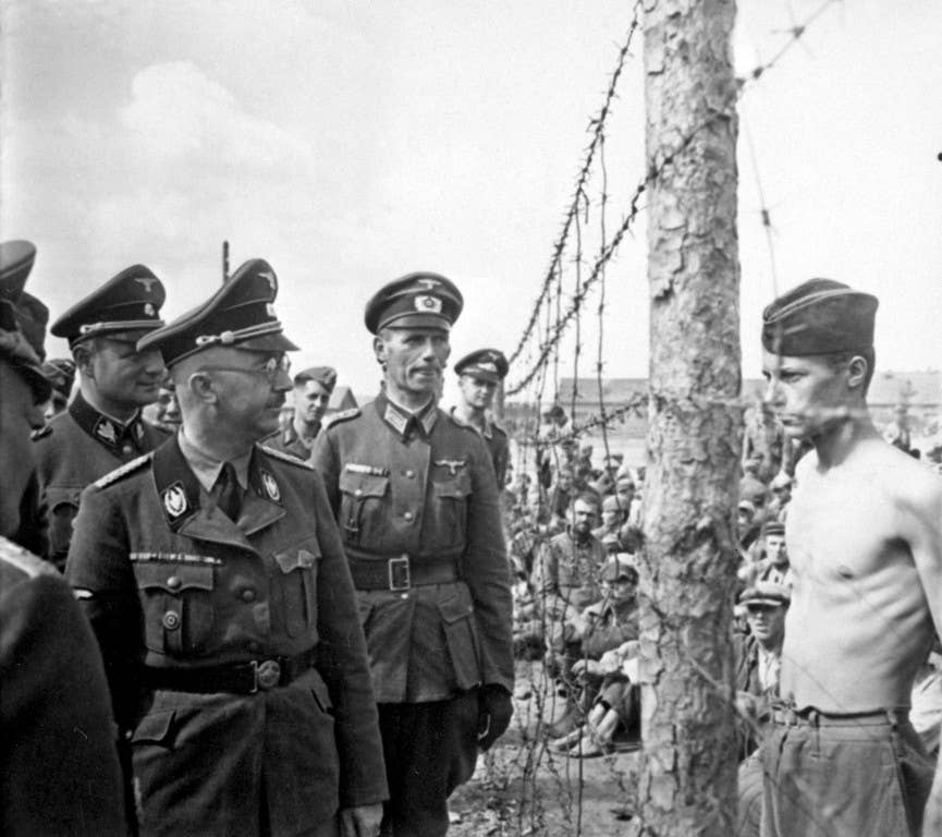 A thin but defiant Horace Greasley stares down Heinrich Himmler during a prison inspection Photo: Wiki Commons
