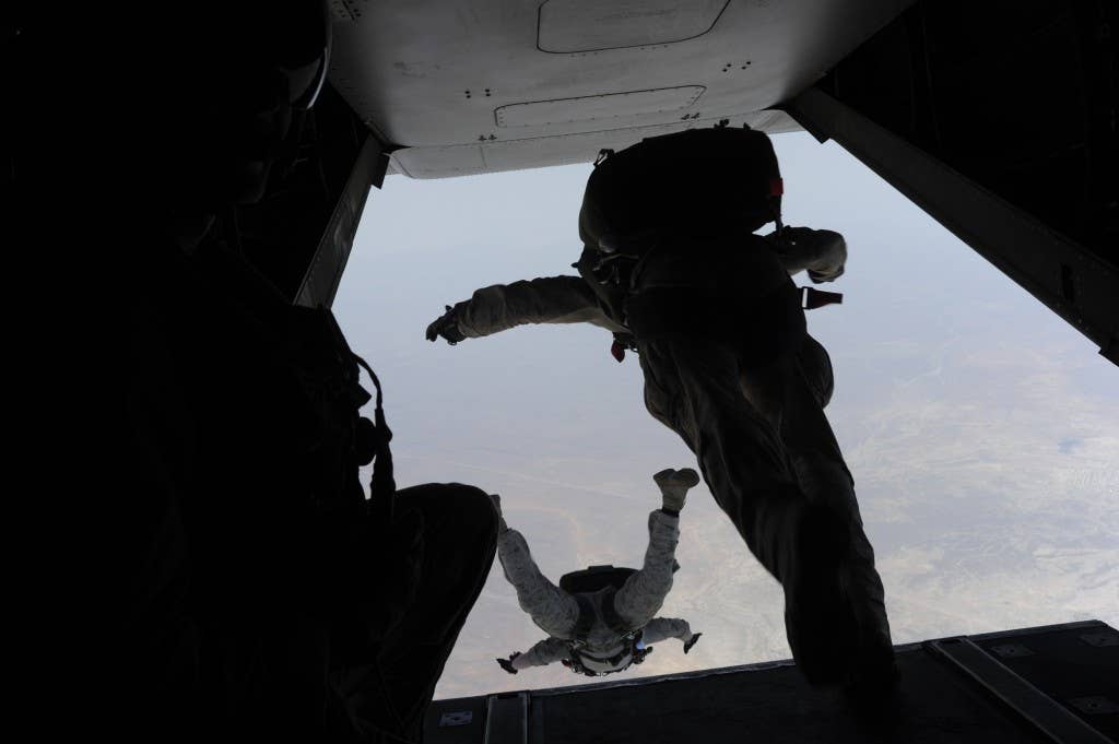 U.S. Marines assigned to Force Reconnaissance Platoon, 22nd Marine Expeditionary Unit free fall from an MV-22 Osprey tiltrotor aircraft during a parachute operations flight over Djibouti June 3, 2014. (U.S. Air Force photo by Staff Sgt. Jocelyn Ford/Released)