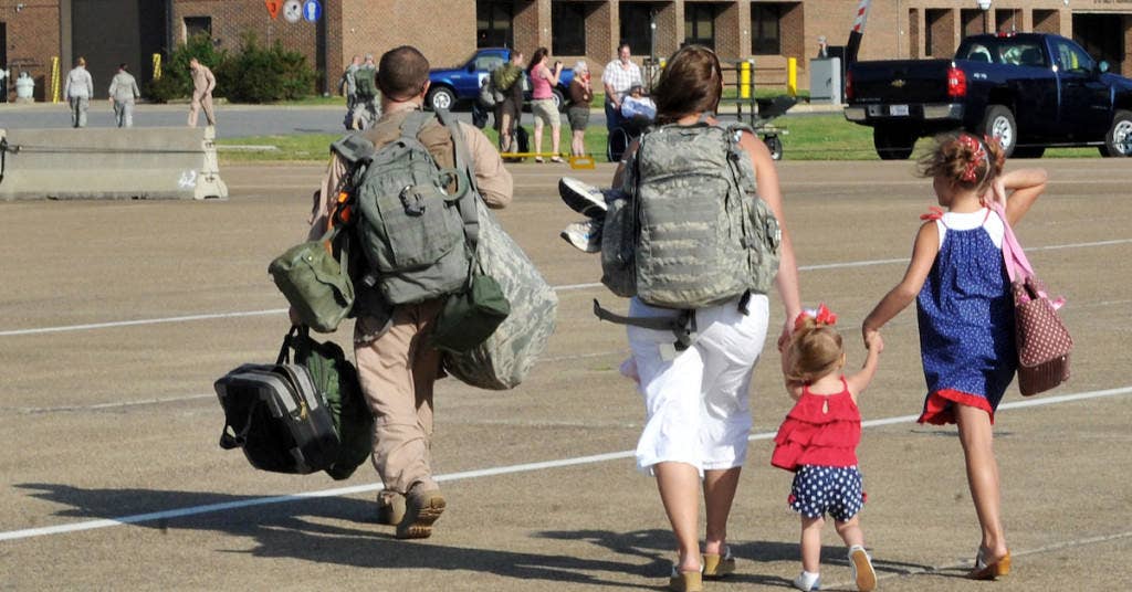 Staff Sgt. John Carlin walks off the flightline with his family May 13, 2001, at Little Rock Air Force Base, Ark. Sergeant Carlin is assigned to the 61st Airlift Squadron. (U.S. Air Force photo/Staff Sgt. Chris Willis)