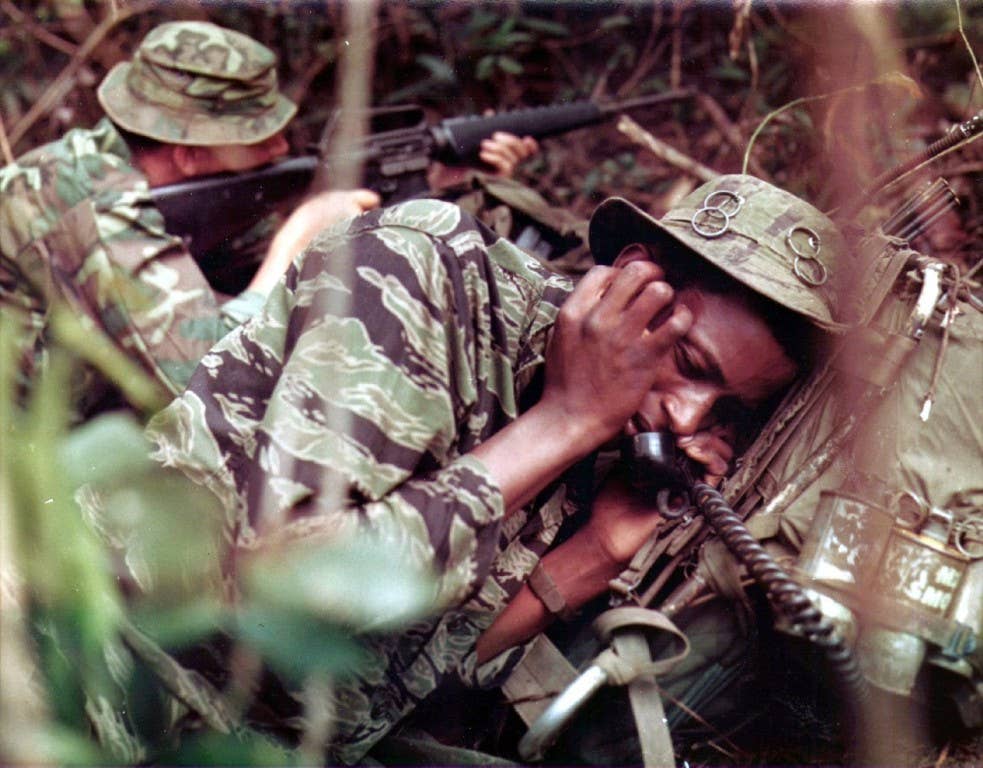 Tigerstripe uniform (foreground) and ERDL pattern (background), in use by US forces in Vietnam c.1969 (Photo: US Army Heritage and Education Center)