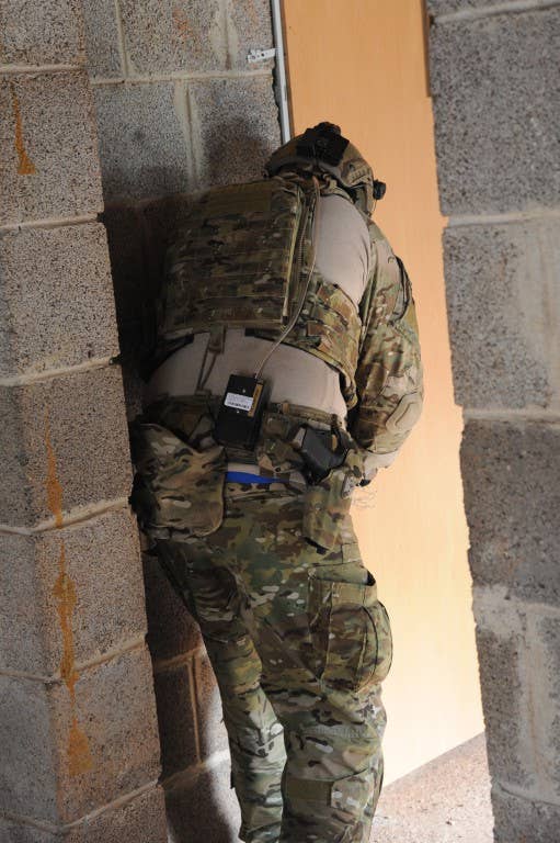 A Special Forces soldier attaches a breaching charge to a door during training. Photo: US Army Visual Information Specialist Ruediger Hess