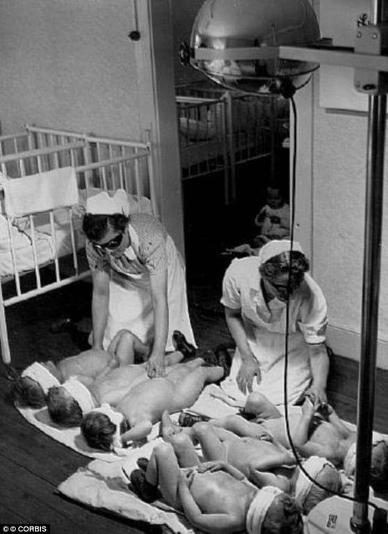 Nazi nurses wear goggles as they administer the light treatment. Photo: Daily Mail