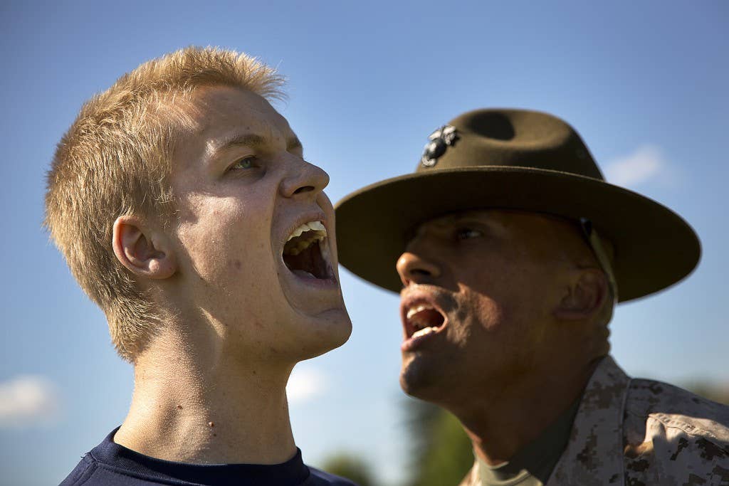 Wyatt Vogelzang, a Marine enlistee from Seattle, responds to a command from Sgt. Aldo Valencia, a drill instructor from Marine Corps Recruit Depot San Diego, during a Recruiting Station Seattle pool function at the Yakima Training Center in Yakima, Wash., July 17, 2015. During the event, recruiters teamed with drill instructors to physically and mentally prepare enlistees from Washington and Idaho for boot camp. The enlistees, part of the Marine Corps delayed entry program, are awaiting their ship dates. Vogelzang, 20, graduated from Roosevelt High School and was recruited by Sgt. Bryan Mack. Valencia, 25, is from Denver and is currently assigned to Delta Company, 1st Recruit Training Battalion. (U.S Marine Corps photo by Sgt. Reece Lodder)