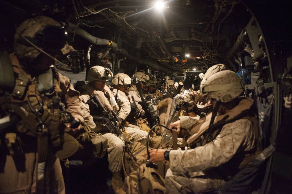 A quick reaction force with Special-Purpose Marine Air-Ground Task Force Crisis Response prepares to depart Naval Air Station Sigonella, Italy, in support of a military assisted departure from the U.S. Embassy in Tripoli, Libya, Saturday, July 26, 2014. Photo: US Marine Corps 1st Lt. Maida Kalic