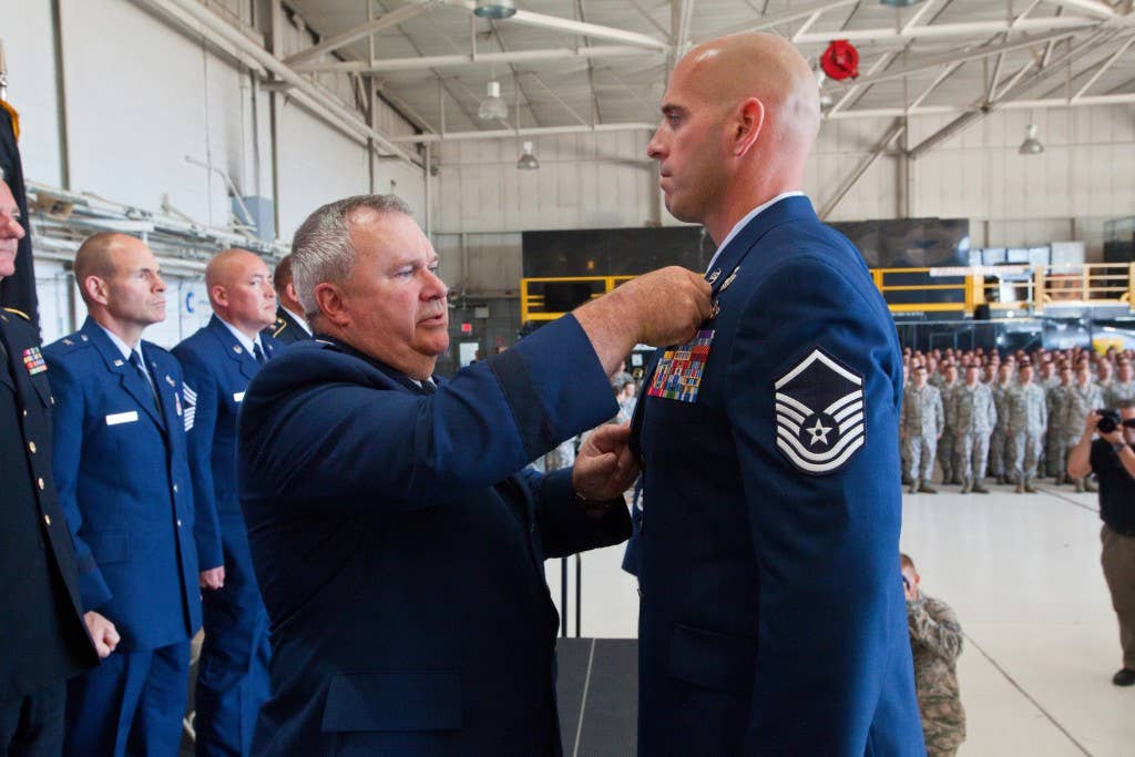 Brig. Gen. Michael L. Cunniff, left, the adjutant general of New Jersey, presents Master Sgt. Michael F. Sears, 177th Fighter Wing, the Silver Star, the third highest military award, June 28, 2014. (U.S. Air National Guard photo by Master Sgt. Mark C. Olsen/Released)