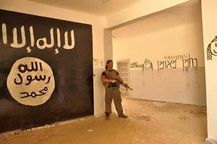 A Jewish volunteer spray-painted on the walls of a captured ISIS stronghold (FB Photo: Lions of Rojava)