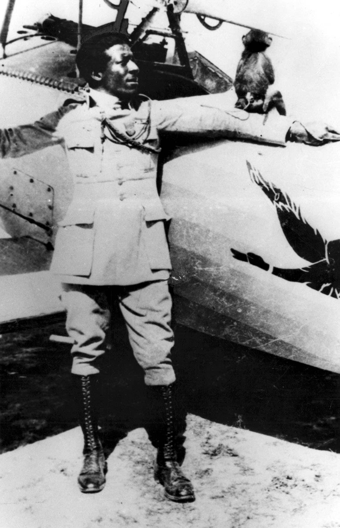Eugene Jacques Bullard poses with his monkey who sometimes accompanied him on missions. Photo: US Air Force historical photo