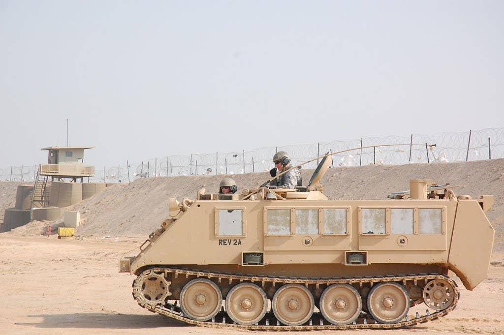 Two M5 modular crowd control munitions are mounted on the&nbsp;side of this M-113 armored personnel carrier in Camp Bucca, Iraq, in 2008. Photo: Capt. Jason McCree
